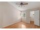 Bedroom with a ceiling fan, wood floors, and a view into a walk-in closet at 2725 S Nellis Blvd # 2049, Las Vegas, NV 89121