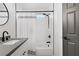 Shower with white tile and black hardware at 305 Napa Hills Dr, Las Vegas, NV 89144