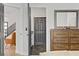 Bedroom featuring access to the Primary bathroom, wooden dresser, and gray interior doors at 305 Napa Hills Dr, Las Vegas, NV 89144
