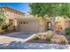 Attractive home with a two-car garage and mature landscaping at 305 Napa Hills Dr, Las Vegas, NV 89144