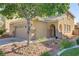 Stylish home featuring a spacious garage, well-maintained landscaping, and inviting entrance at 305 Napa Hills Dr, Las Vegas, NV 89144