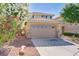 Charming home featuring a spacious garage and well-maintained landscaping at 305 Napa Hills Dr, Las Vegas, NV 89144