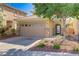 Lovely home with a two-car garage and desert landscaping at 305 Napa Hills Dr, Las Vegas, NV 89144