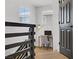 Hallway leading to an office with a modern desk and a black door at 305 Napa Hills Dr, Las Vegas, NV 89144