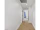 Bright hallway with wood floors leads to bedrooms at 305 Napa Hills Dr, Las Vegas, NV 89144