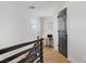 Hallway leading to an office with a modern desk and a black door at 305 Napa Hills Dr, Las Vegas, NV 89144