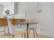 Charming dining area with a modern table set adjacent to a stylish kitchen at 305 Napa Hills Dr, Las Vegas, NV 89144