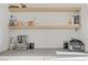 Kitchen counter featuring espresso machine, air fryer, floating wooden shelves and white subway tile at 305 Napa Hills Dr, Las Vegas, NV 89144