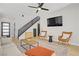 Stylish living room showcasing modern furniture, light hardwood floors, and an open staircase at 305 Napa Hills Dr, Las Vegas, NV 89144
