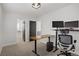 Office space features a comfortable chair and modern desk setup with an adjacent closet at 305 Napa Hills Dr, Las Vegas, NV 89144