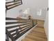 Bright and airy staircase leading to a cozy living area with a comfortable couch and large windows at 305 Napa Hills Dr, Las Vegas, NV 89144