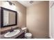 Cozy bathroom featuring a sink, a toilet, and granite counters at 310 Pissarro Pl, Henderson, NV 89074