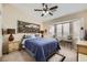Cozy bedroom featuring a ceiling fan, neutral colors, and bay window at 310 Pissarro Pl, Henderson, NV 89074