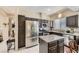 Modern kitchen with a stainless steel refrigerator, center island, and ample cabinet space at 310 Pissarro Pl, Henderson, NV 89074