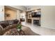 Spacious living room with a fireplace, tile flooring, and comfortable seating arrangement at 310 Pissarro Pl, Henderson, NV 89074