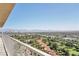 Breathtaking balcony view with a serene landscape overlooking lush greenery and city buildings at 3111 Bel Air Dr # 22B, Las Vegas, NV 89109