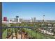 Wide balcony view overlooking a golf course with an expansive cityscape skyline at 3111 Bel Air Dr # 22B, Las Vegas, NV 89109