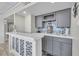 Well lit bar area features sleek countertop and bar with attractive, light neutral finishes at 3111 Bel Air Dr # 22B, Las Vegas, NV 89109