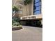 Inviting Regency Towers entrance featuring manicured landscaping and porte cochere at 3111 Bel Air Dr # 22B, Las Vegas, NV 89109