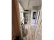 Hallway to bathroom with dual sinks, soaking tub, and vanity lighting at 3111 Bel Air Dr # 22B, Las Vegas, NV 89109