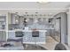 Bright kitchen features gray cabinets, modern appliances, mosaic backsplash, and counter seating at the island at 3111 Bel Air Dr # 22B, Las Vegas, NV 89109