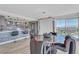 Modern kitchen with gray cabinets, stainless steel appliances, counter seating, and a stunning city view at 3111 Bel Air Dr # 22B, Las Vegas, NV 89109