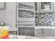 Close up of the built in double oven with stainless steel finish and modern cabinets at 3111 Bel Air Dr # 22B, Las Vegas, NV 89109