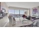 Chic living area with large windows, comfortable seating, and scenic city views at 3111 Bel Air Dr # 22B, Las Vegas, NV 89109