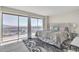 Beautiful main bedroom featuring a large window with spectacular city views and a plush bed at 3111 Bel Air Dr # 22B, Las Vegas, NV 89109