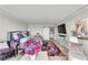 Comfortable main bedroom with plush bedding, decorative rug, and TV at 3111 Bel Air Dr # 22B, Las Vegas, NV 89109