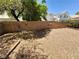 Spacious backyard featuring a desert landscape, providing privacy and minimal maintenance requirements at 3665 Lucky Horseshoe Ct, Las Vegas, NV 89129