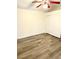 Bedroom boasts plank floors, ceiling fan, and a double-door closet perfect for storage at 3665 Lucky Horseshoe Ct, Las Vegas, NV 89129