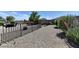 Expansive backyard showcasing desert landscaping and decorative wrought iron fencing at 3823 Aspen Creek Ave, North Las Vegas, NV 89031
