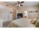 This bedroom includes an ensuite bathroom and natural light, and the neutral color scheme contributes to a peaceful ambiance at 3823 Aspen Creek Ave, North Las Vegas, NV 89031
