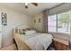 Cozy bedroom with a plush bed, stylish decor, and a window for natural light at 3823 Aspen Creek Ave, North Las Vegas, NV 89031