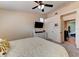 Well-lit bedroom showcasing modern comfort with a sleek TV, plentiful storage, and seamless flow into adjacent spaces at 3823 Aspen Creek Ave, North Las Vegas, NV 89031