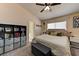 This bedroom has an abundance of storage and natural light, features a neutral color scheme, and offers comfortable furnishing at 3823 Aspen Creek Ave, North Las Vegas, NV 89031
