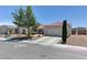 Lovely single-story home with a tile roof, two-car garage, and desert landscaping at 3823 Aspen Creek Ave, North Las Vegas, NV 89031