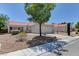 Charming single-story home featuring a well-manicured lawn, mature trees, and a two-car garage at 3823 Aspen Creek Ave, North Las Vegas, NV 89031