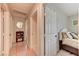 Hallway with several doors leading to bedrooms and other areas of the home at 3823 Aspen Creek Ave, North Las Vegas, NV 89031
