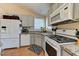 Well-lit kitchen featuring granite countertops, modern appliances, and ample cabinet space at 3823 Aspen Creek Ave, North Las Vegas, NV 89031