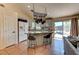 Open-concept kitchen featuring granite countertops, stainless steel appliances, and seating at the island at 3823 Aspen Creek Ave, North Las Vegas, NV 89031