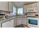 Bright kitchen featuring granite countertops, white appliances, and ample cabinet space at 3823 Aspen Creek Ave, North Las Vegas, NV 89031
