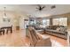 Open living space featuring tile floors, cozy seating, and access to both the kitchen and dining area at 3823 Aspen Creek Ave, North Las Vegas, NV 89031
