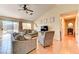 Bright living room with sliding glass doors, comfortable seating, and stylish decor at 3823 Aspen Creek Ave, North Las Vegas, NV 89031
