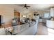 Spacious open-concept living area connecting the living room, dining area, and modern kitchen at 3823 Aspen Creek Ave, North Las Vegas, NV 89031