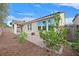 Backyard featuring low maintenance landscaping, a brick patio, and a privacy wall at 4020 Recktenwall Ave, North Las Vegas, NV 89081