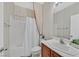 Bathroom with a shower, vanity, and decorative wallpaper at 4020 Recktenwall Ave, North Las Vegas, NV 89081