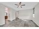 Spacious Primary bedroom featuring a ceiling fan and tiled floors at 4020 Recktenwall Ave, North Las Vegas, NV 89081