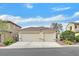 Charming home featuring a desert landscape, driveway, and a two-car garage at 4020 Recktenwall Ave, North Las Vegas, NV 89081